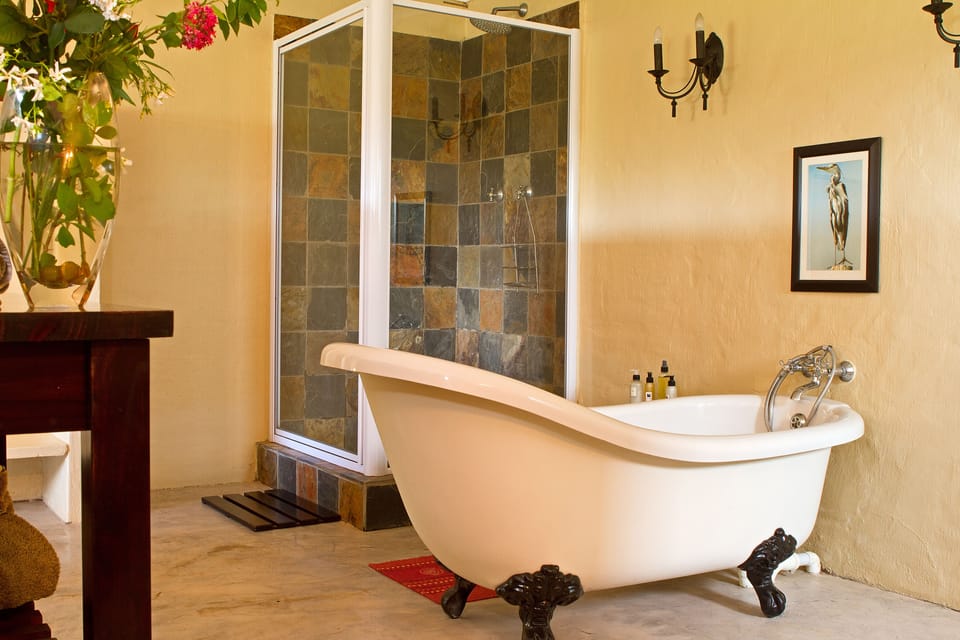 Separate tub and shower, deep soaking tub, free toiletries, towels