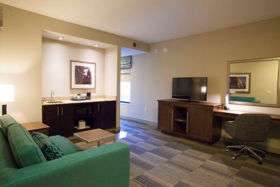 Desk, laptop workspace, blackout drapes, iron/ironing board