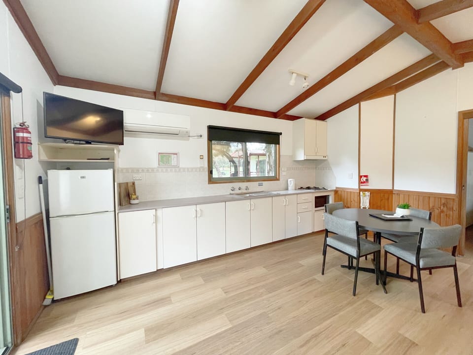 Spa Family Cabin | Private kitchen | Fridge, microwave, stovetop, electric kettle