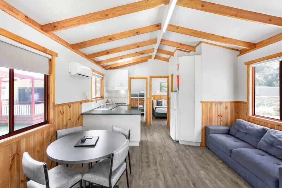 Deluxe Cabin 4 Berth | Living room | 32-inch flat-screen TV with digital channels, TV, DVD player