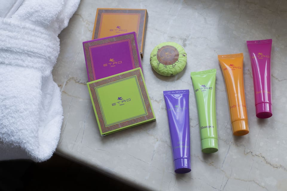 Shower, designer toiletries, hair dryer, slippers