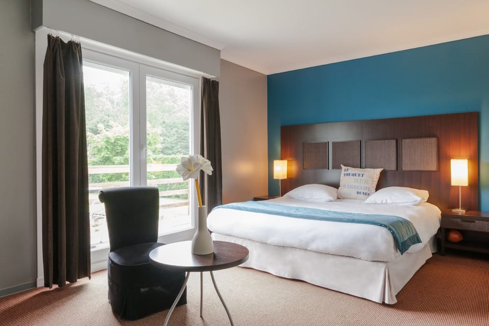 Deluxe Double Room, Garden Area | Minibar, in-room safe, individually decorated, soundproofing