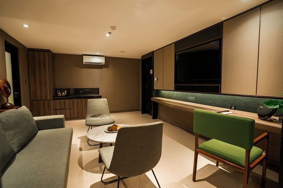 Executive Suite Room with Balcony | Living area | 42-inch flat-screen TV with cable channels, TV