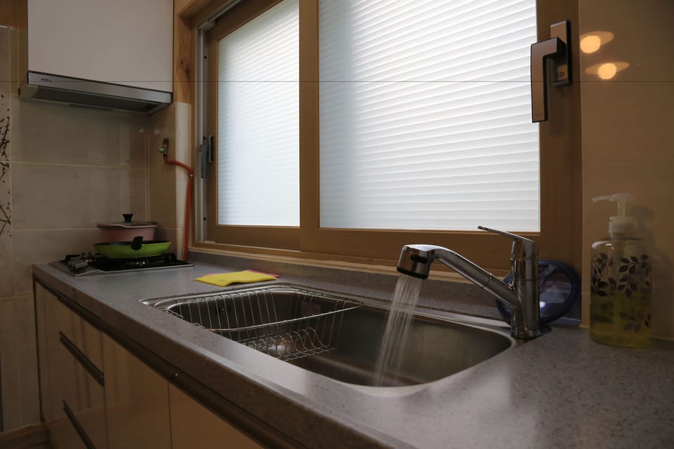 Family House, 2 Bedrooms | Private kitchenette | Full-size fridge, microwave, stovetop, coffee/tea maker