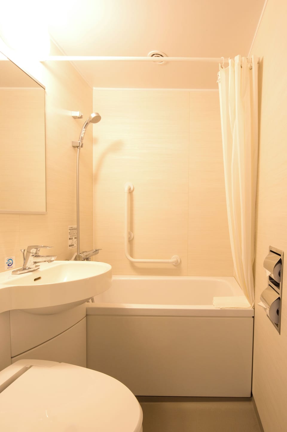 Combined shower/tub, free toiletries, hair dryer, slippers