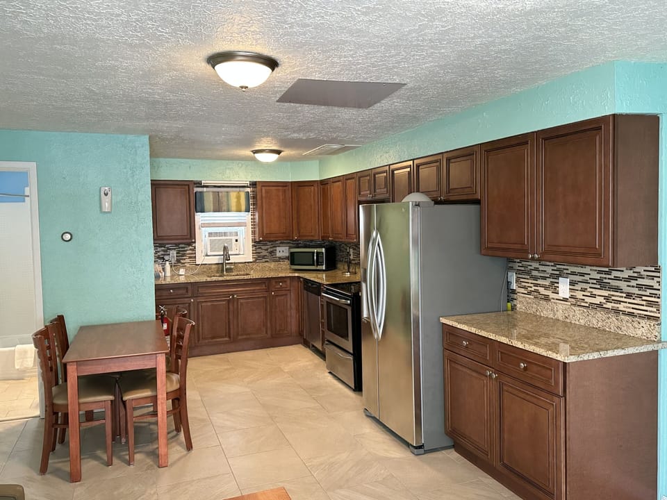Grand Apartment, Multiple Beds, Kitchen | Private kitchen | Coffee/tea maker, full-size fridge, microwave, cookware/dishes/utensils