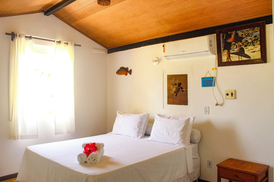 Standard Triple Room, Ocean View | Minibar, bed sheets