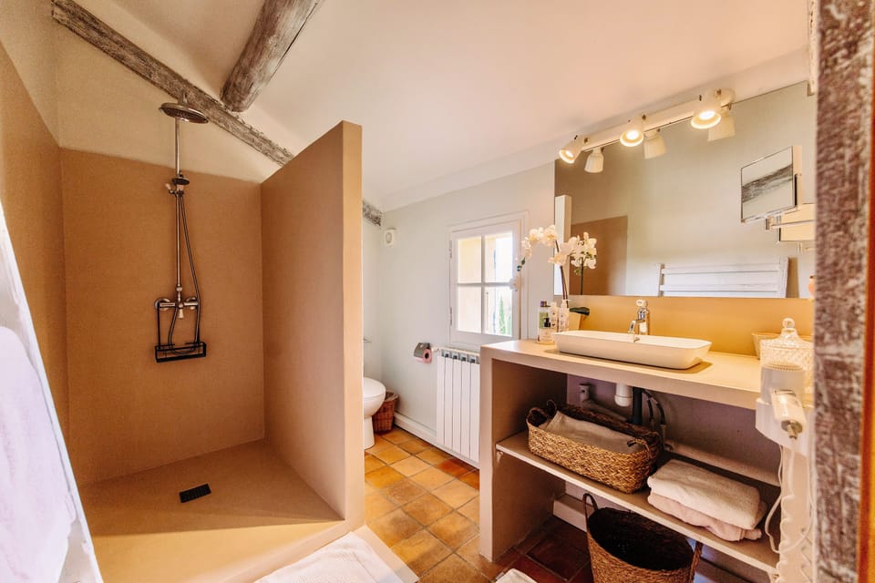 Suite | Bathroom | Shower, designer toiletries, hair dryer, slippers
