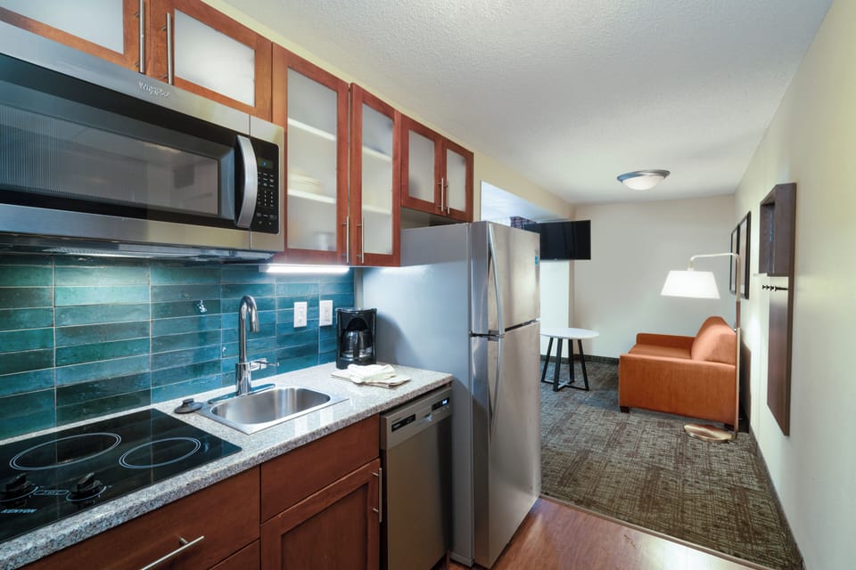 Blackout drapes, iron/ironing board, cribs (free), WiFi (free)