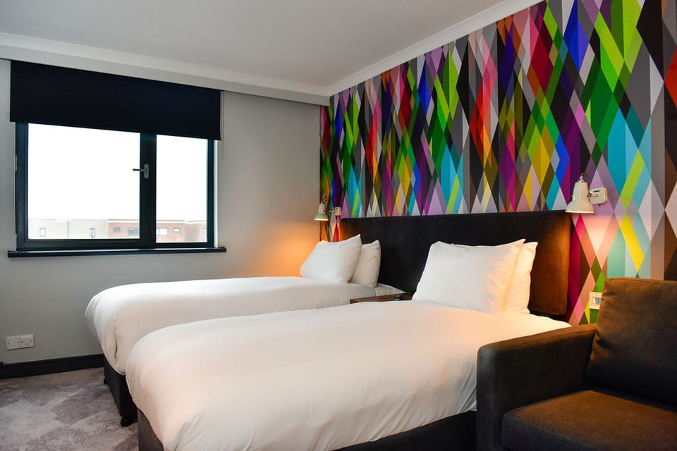 Desk, laptop workspace, blackout drapes, iron/ironing board