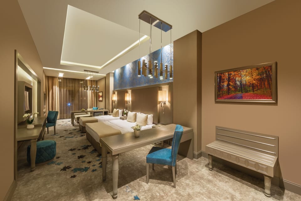 Junior Triple Room | Minibar, in-room safe, desk, laptop workspace