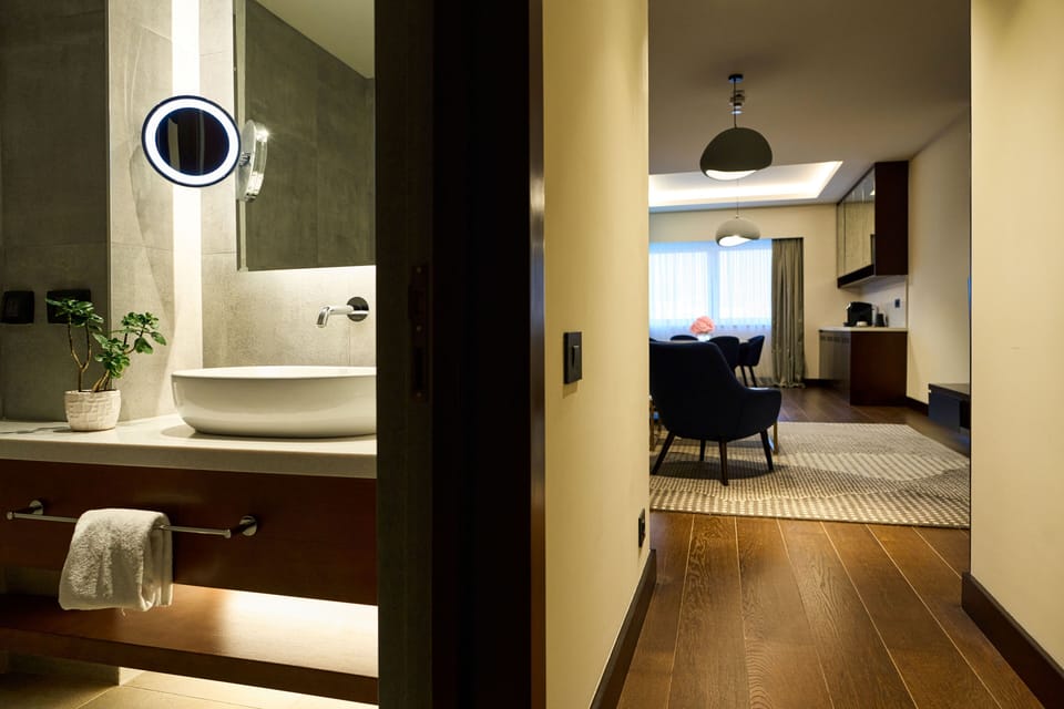 Executive Suite | Bathroom | Designer toiletries, hair dryer, bathrobes, slippers