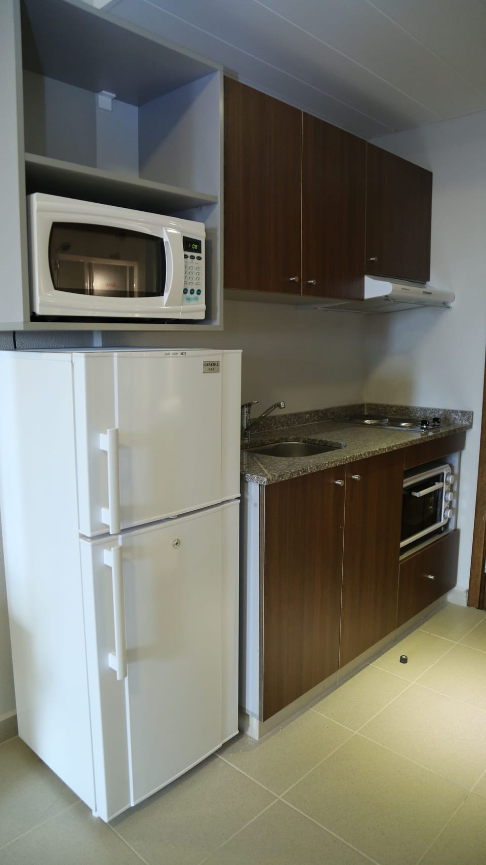 Full-size fridge, microwave, stovetop, cookware/dishes/utensils