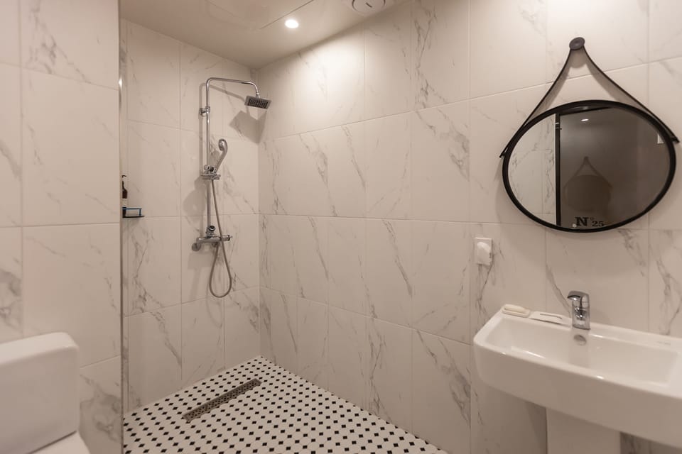 Separate tub and shower, free toiletries, hair dryer, slippers