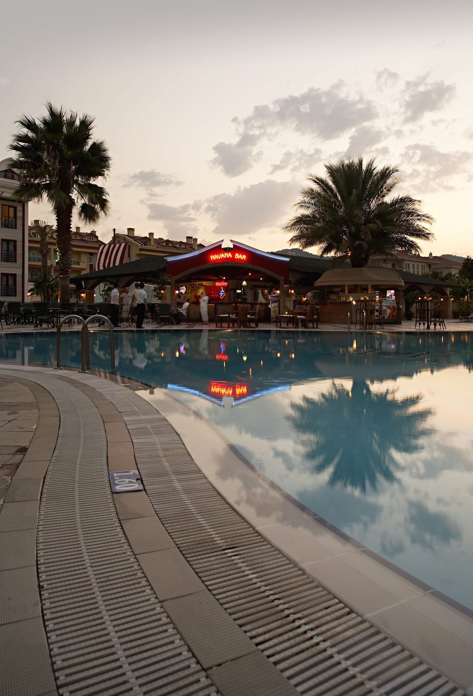 Seasonal outdoor pool, open 8:00 AM to 6:30 PM, pool umbrellas