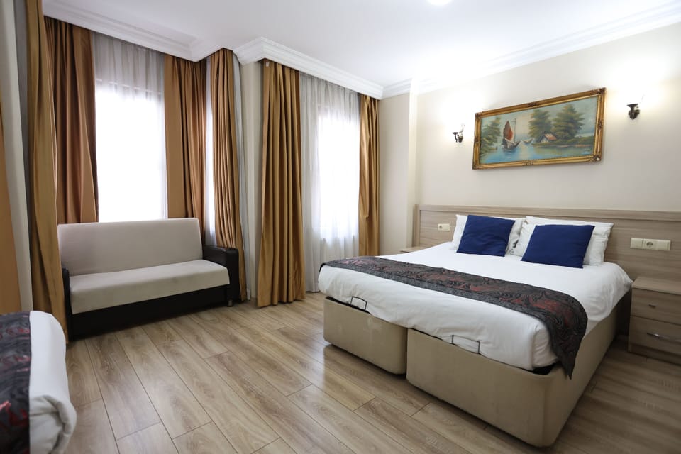 Family Room, 1 Bedroom | Minibar, in-room safe, desk, laptop workspace