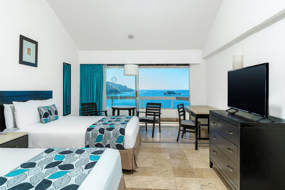 Standard Room, Sea View | Down comforters, in-room safe, desk, blackout drapes