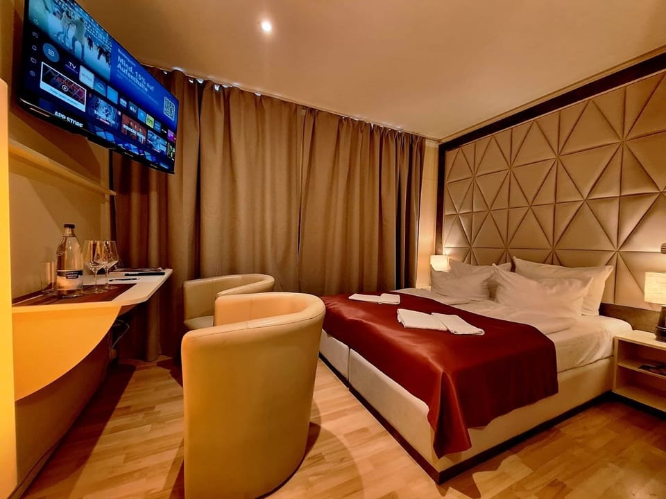 Hypo-allergenic bedding, down comforters, pillowtop beds, in-room safe