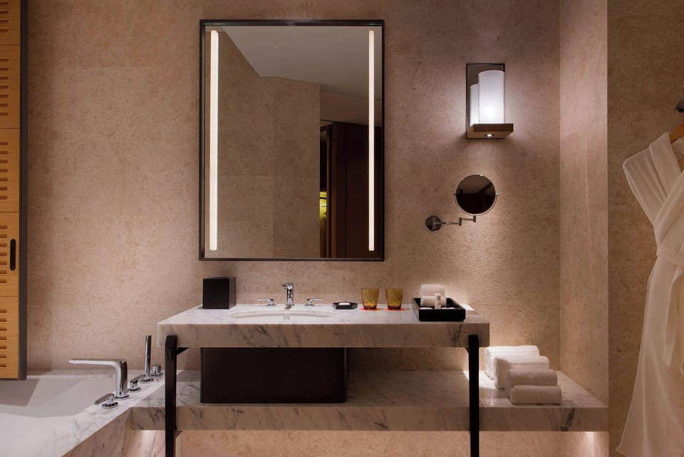 Designer toiletries, hair dryer, bathrobes, slippers