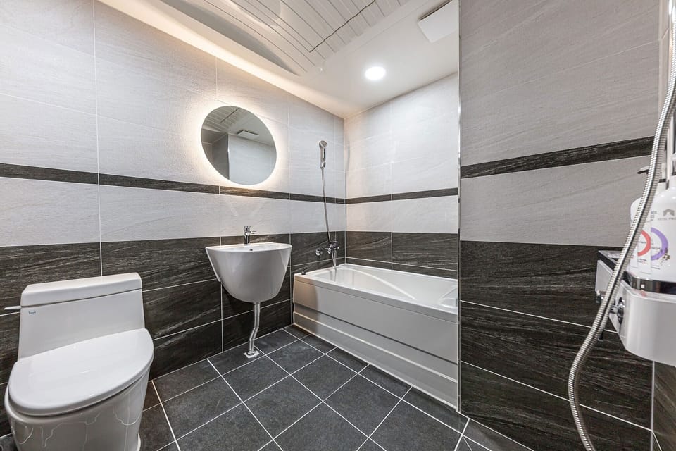 Separate tub and shower, free toiletries, hair dryer, bathrobes