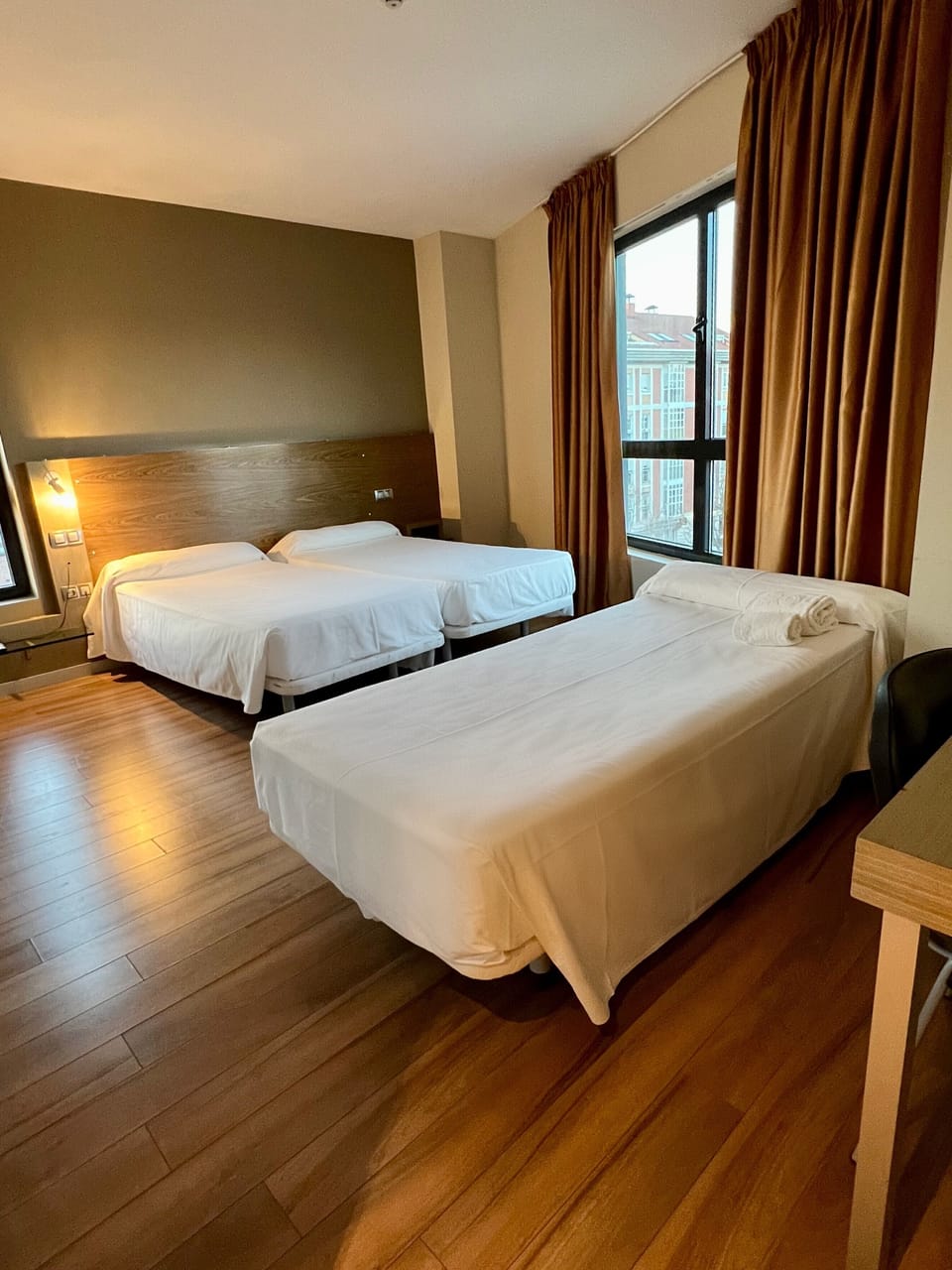 Standard Triple Room | Minibar, in-room safe, desk, blackout drapes