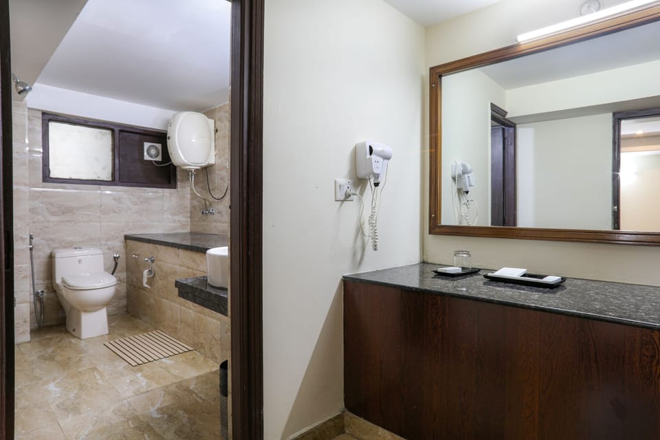 Deluxe Family Room | Bathroom | Shower, free toiletries, hair dryer, slippers