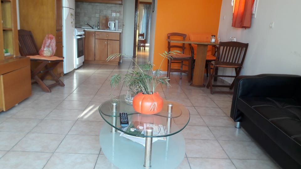 Family Apartment, 1 Bedroom, Beach View | Living area | Flat-screen TV