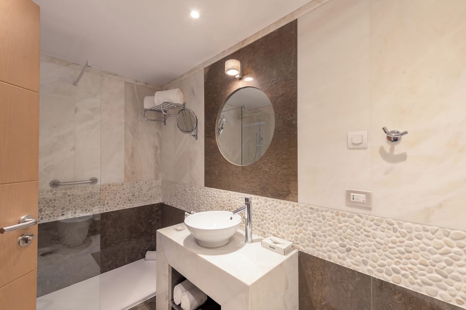 Deluxe Room, Ocean View | Bathroom | Combined shower/tub, deep soaking tub, rainfall showerhead