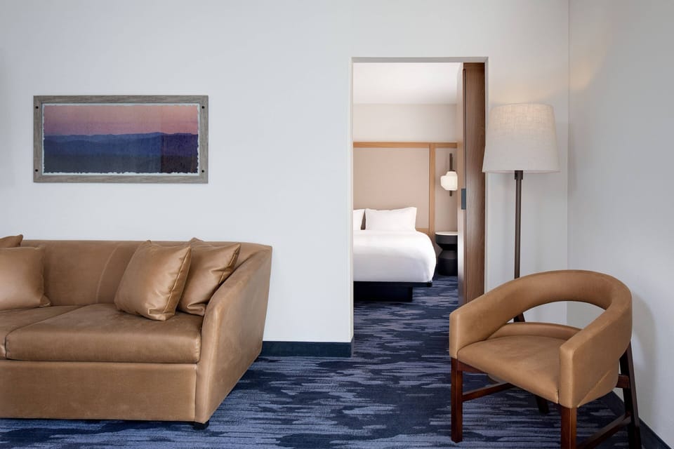 Premium bedding, desk, laptop workspace, blackout drapes