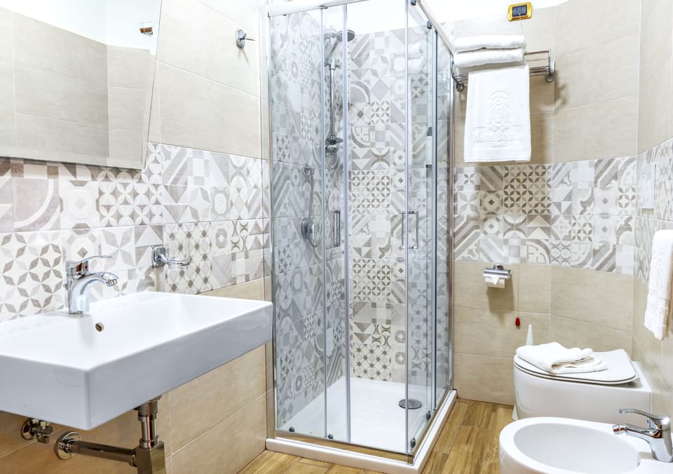 Shower, free toiletries, hair dryer, slippers