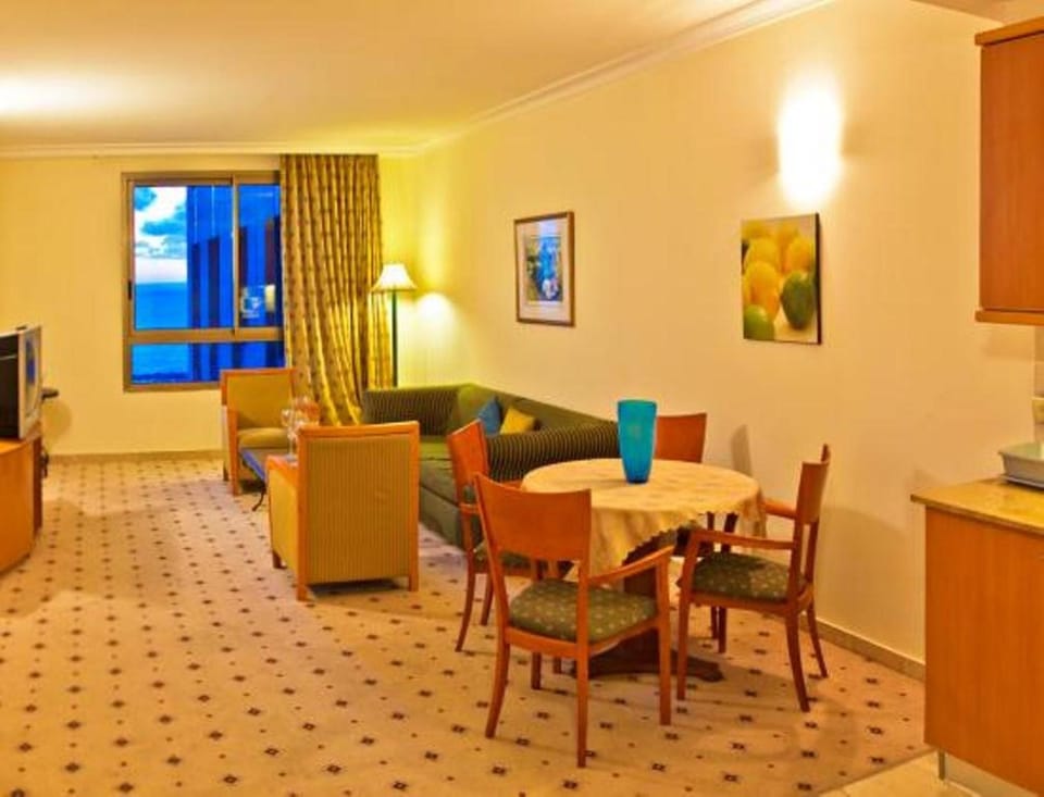 Deluxe Apartment, 1 Bedroom, Sea View, Beachfront | Living area | Flat-screen TV