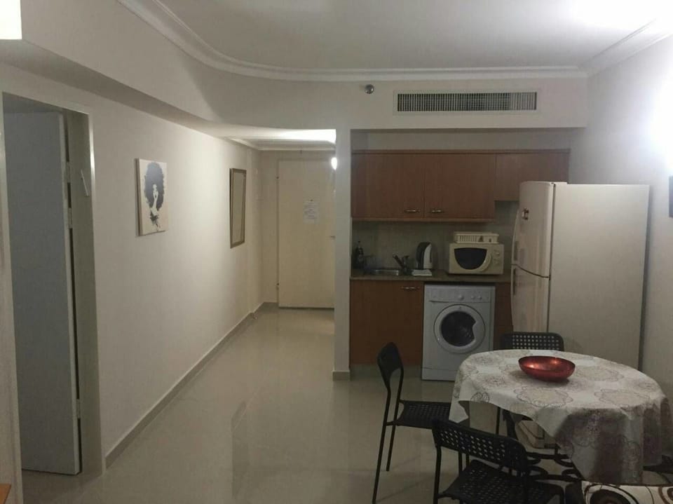 Family Apartment, 1 Bedroom, Sea View, Beachfront | Living area | Flat-screen TV