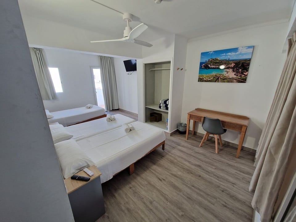 Deluxe Triple Room, Private Bathroom | In-room safe, individually furnished, blackout drapes, free WiFi