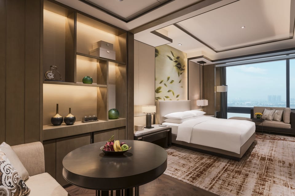 1 King Bed Executive Suite | Living room | 48-inch flat-screen TV with satellite channels, TV