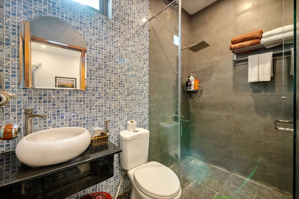Shower, free toiletries, hair dryer, slippers