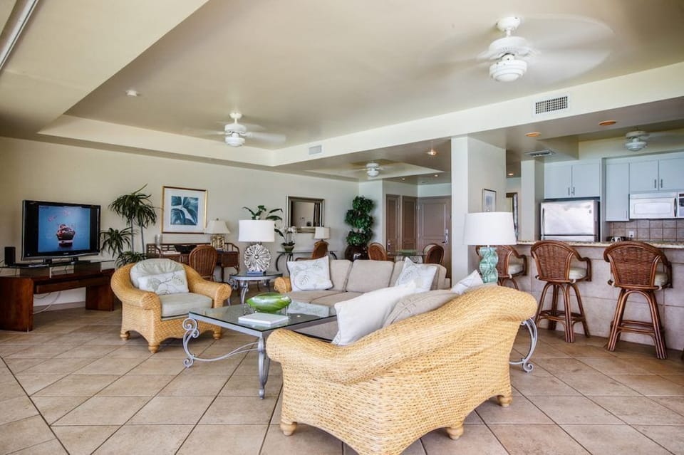 2-Bedroom Oceanfront (1202) | Living area | 50-inch flat-screen TV with cable channels, TV