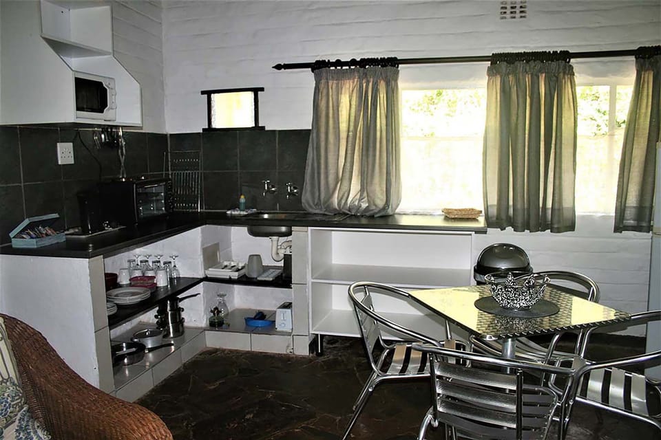 Executive Chalet, 1 Bedroom, River View, Ground Floor (4 Berth) | Private kitchen | Coffee/tea maker, full-size fridge, microwave, electric kettle