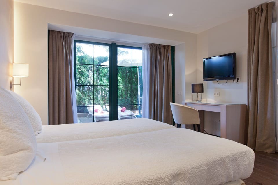 Standard Double or Twin Room | Minibar, in-room safe, desk, blackout drapes