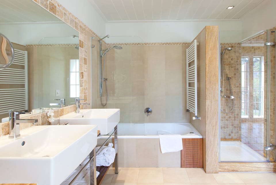 Junior Suite, 1 King Bed | Bathroom | Bathtub, hair dryer, slippers, towels