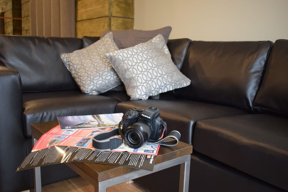 Suite (Room Only) | Living area | Flat-screen TV, DVD player