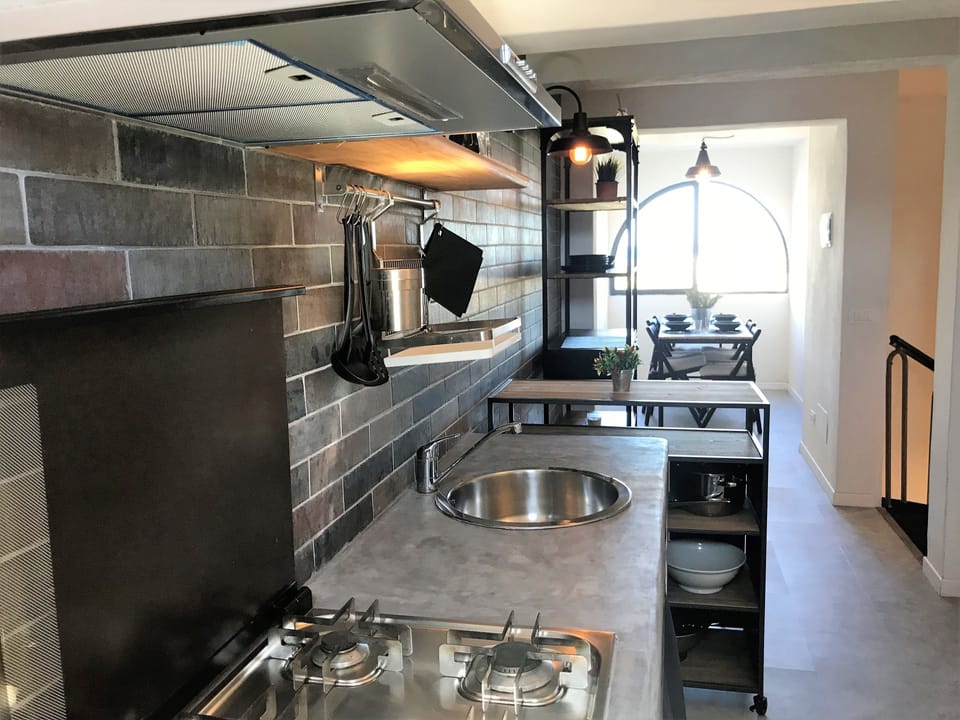 Full-size fridge, stovetop, espresso maker, coffee/tea maker