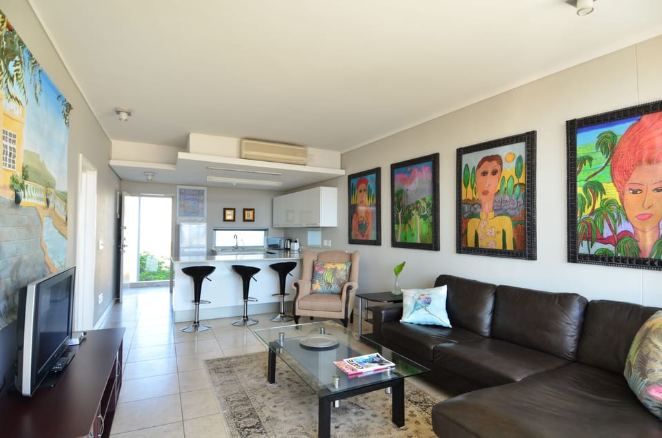 Deluxe Apartment, Canal View | Living area | Flat-screen TV