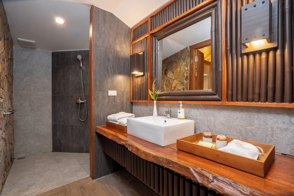 Superior Room | Bathroom | Designer toiletries, hair dryer, slippers, towels