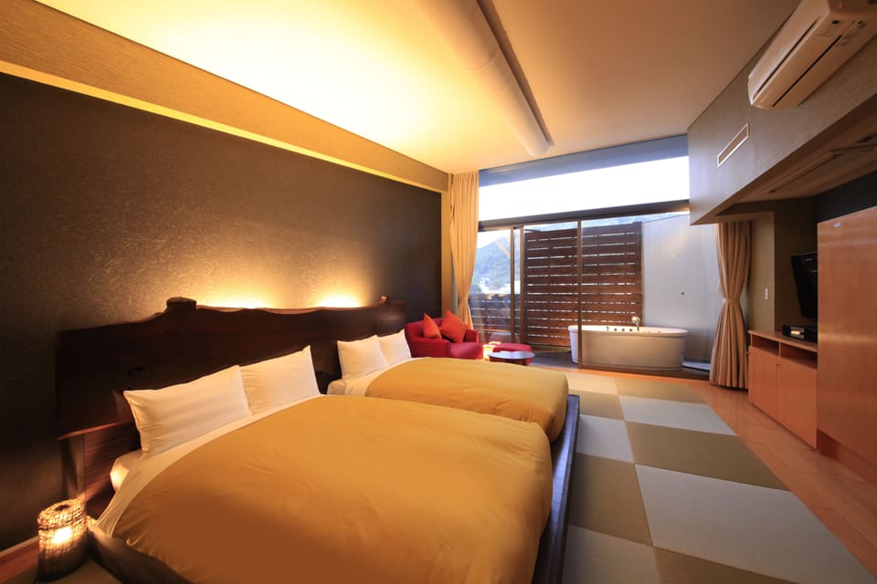 Japanese-Style Twin Room with Open-Air Bath and 2 Japanese Futons - Top Floor | Living room | Flat-screen TV