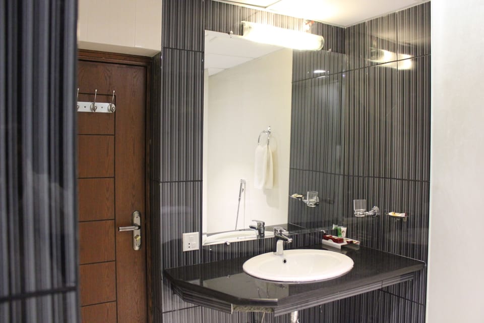 Shower, free toiletries, hair dryer, slippers