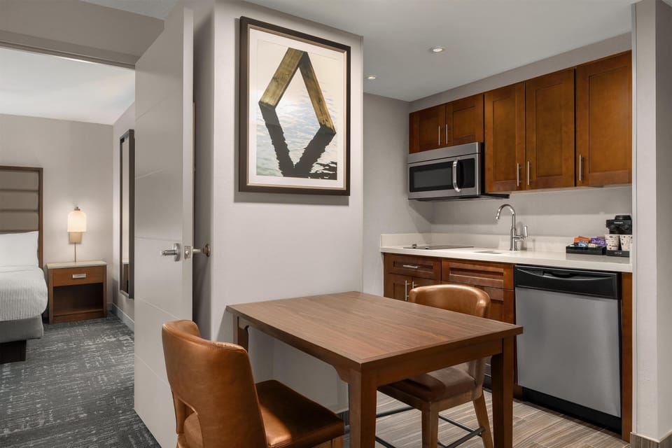 Suite, 1 King Bed | Private kitchen | Full-size fridge, microwave, stovetop, dishwasher