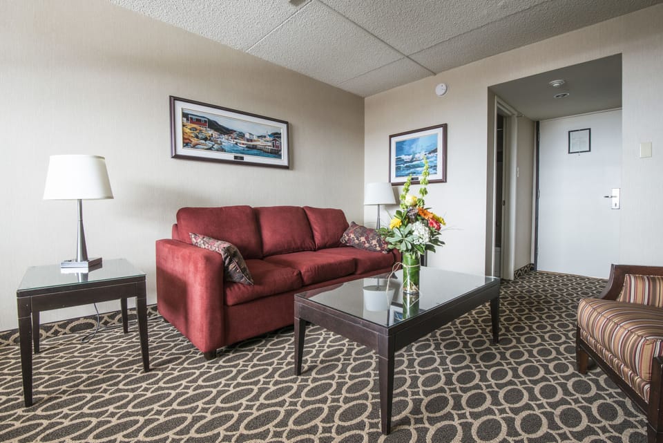 Suite, 1 King Bed with Sofa bed | Living area | 42-inch flat-screen TV with cable channels, TV