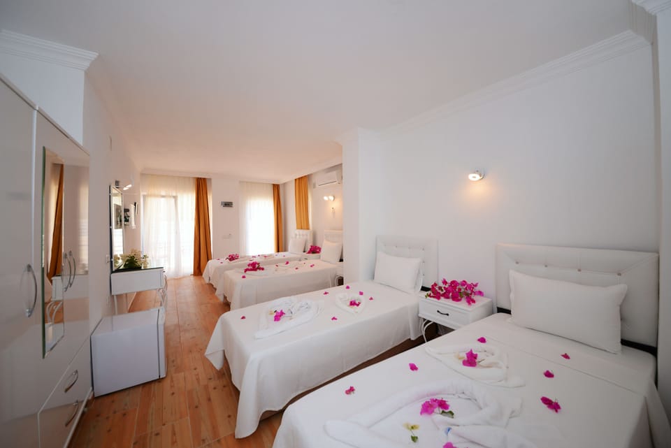 Signature Quadruple Room, Garden Area | Desk, WiFi (free), bed sheets