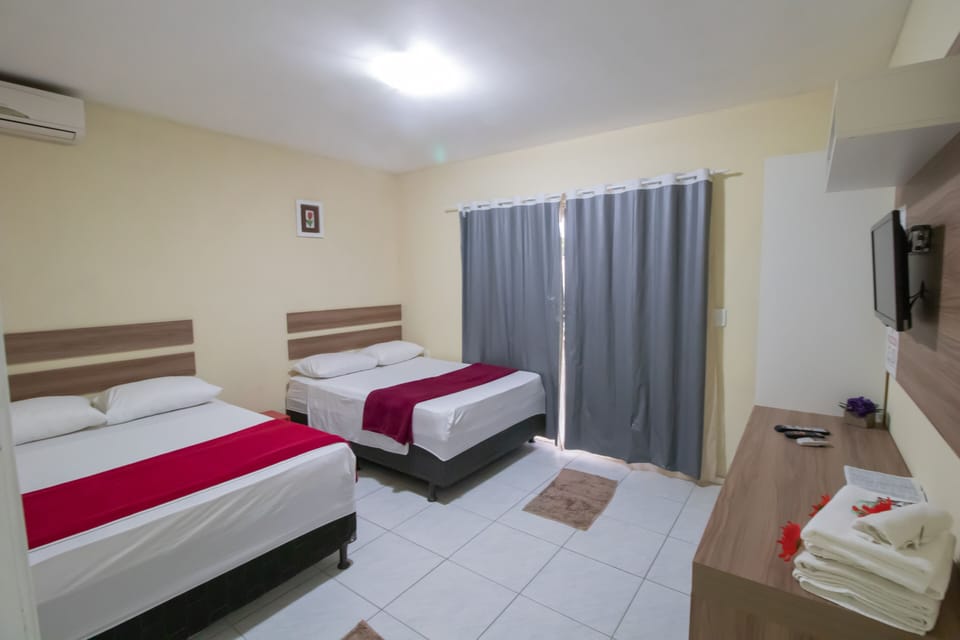 Standard Quadruple Room | Minibar, desk, blackout drapes, free WiFi