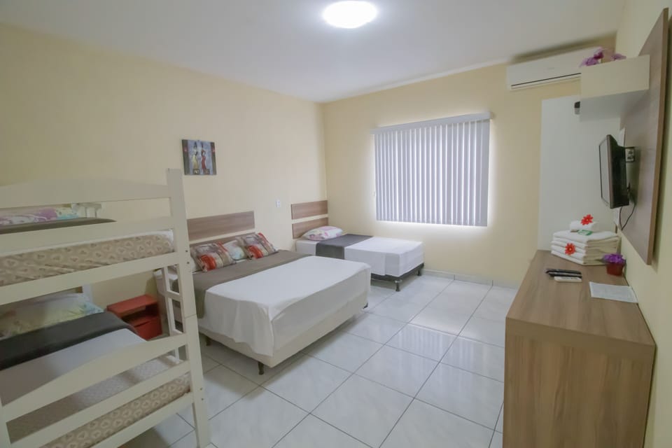 Family Room | Minibar, desk, blackout drapes, free WiFi